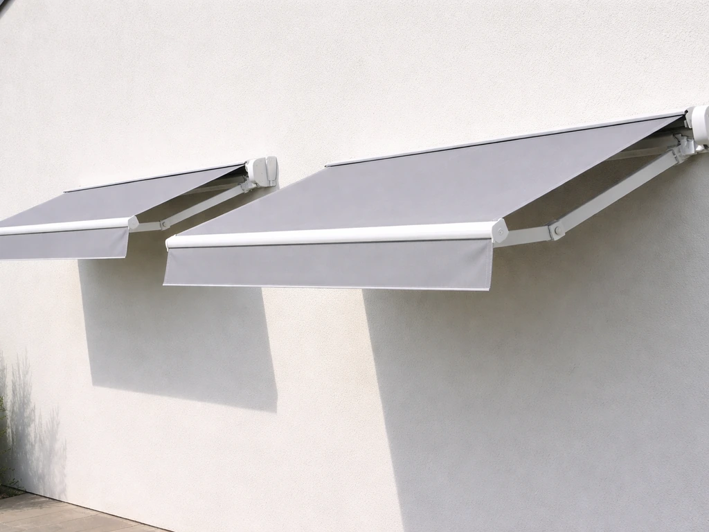 Minimal photo showing two awning frames side-by-side with different outward projection depths from a wall